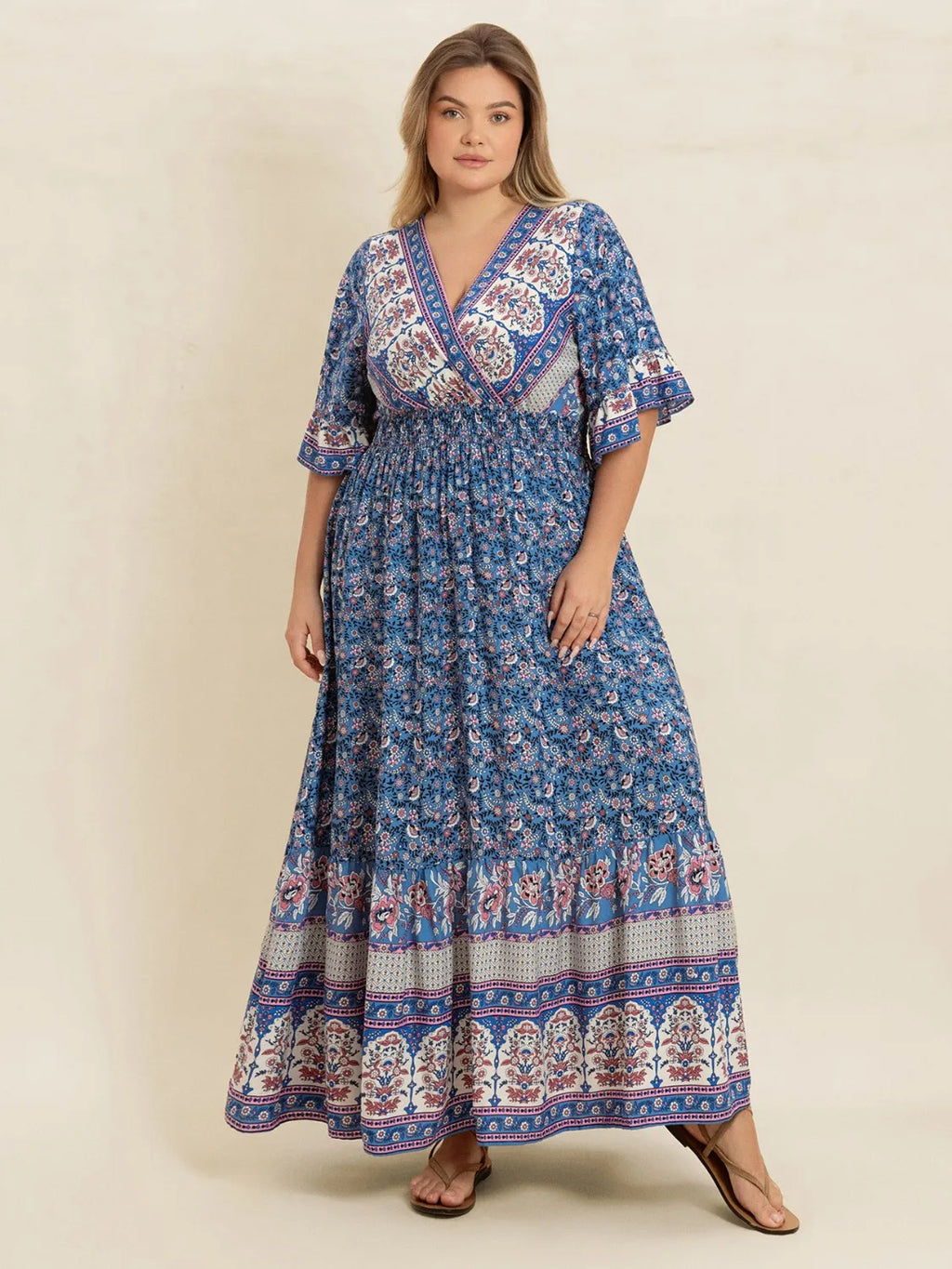 Plus Size Printed Surplice Half Sleeve Dress - Dresses by Trendsi | Available at Handbags Specialist Headquarter