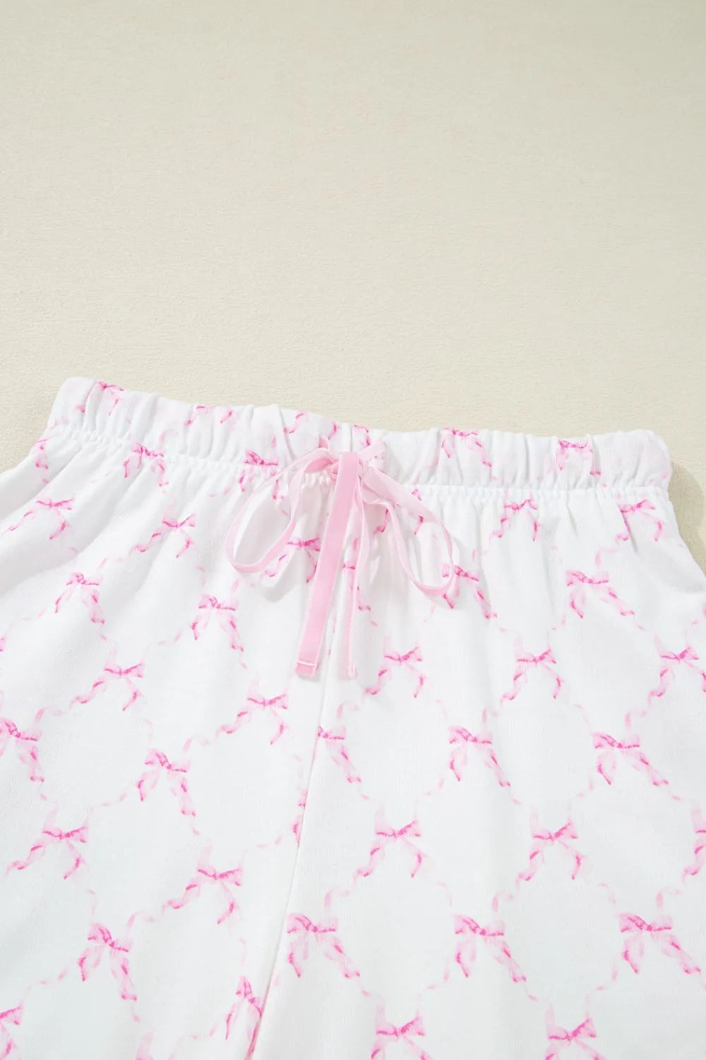 Bow Print Lettuce Trim Round Neck Top and Shorts Lounge Set - Sleepwear by Trendsi | Available at Handbags Specialist Headquarter