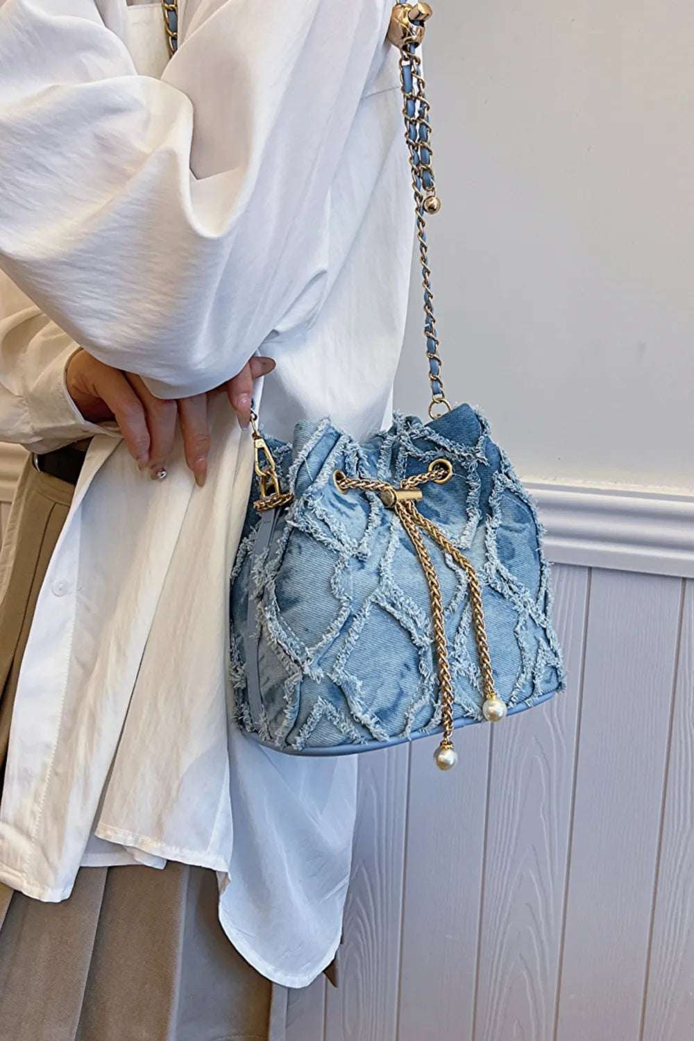 Chain Drawstring Raw Edge Denim Bucket Bag - Crossbody Bag by Trendsi | Available at Handbags Specialist Headquarter