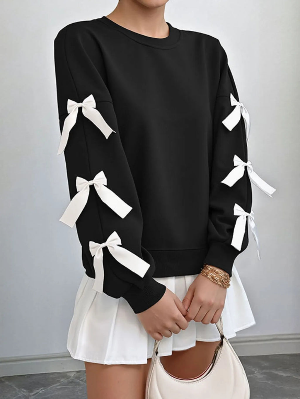 Bow-Detailed Sleeve Round Neck Sweatshirt - Tops by Trendsi | Available at Handbags Specialist Headquarter