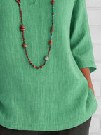 Full Size Notched Three-Quarter Sleeves Blouse Plus Size - Tops by Trendsi | Available at Handbags Specialist Headquarter