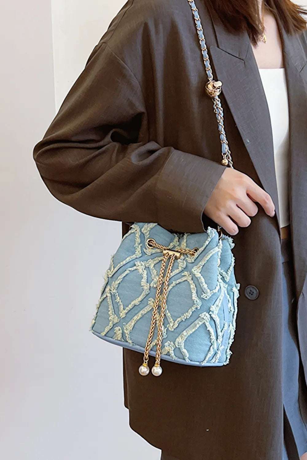 Chain Drawstring Raw Edge Denim Bucket Bag - Crossbody Bag by Trendsi | Available at Handbags Specialist Headquarter
