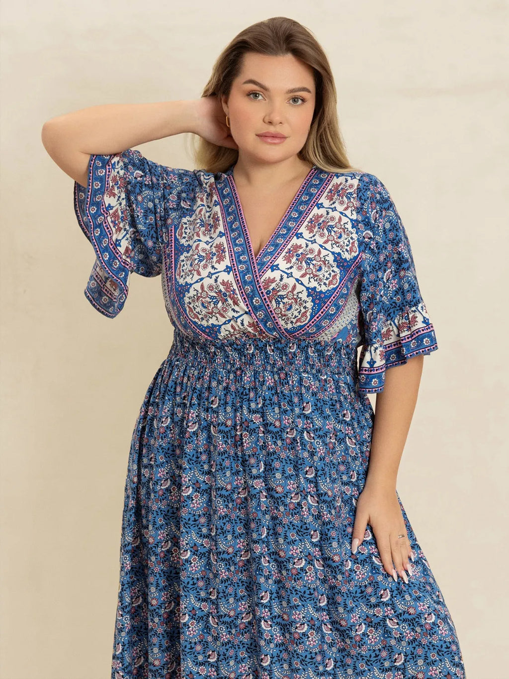 Plus Size Printed Surplice Half Sleeve Dress - Dresses by Trendsi | Available at Handbags Specialist Headquarter