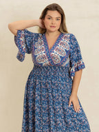 Plus Size Printed Surplice Half Sleeve Dress - Dresses by Trendsi | Available at Handbags Specialist Headquarter