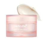 Pink jar of cream labeled "Triple Collagen Cream" with a creamy smear above it.
