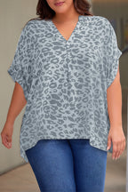 Plus Size Printed Notched Neck Half Sleeve Top - Plus Size Shirts by Trendsi | Available at Handbags Specialist Headquarter