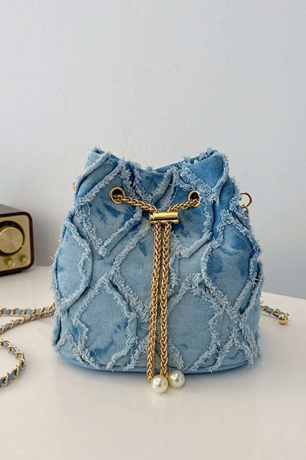 Chain Drawstring Raw Edge Denim Bucket Bag - Crossbody Bag by Trendsi | Available at Handbags Specialist Headquarter