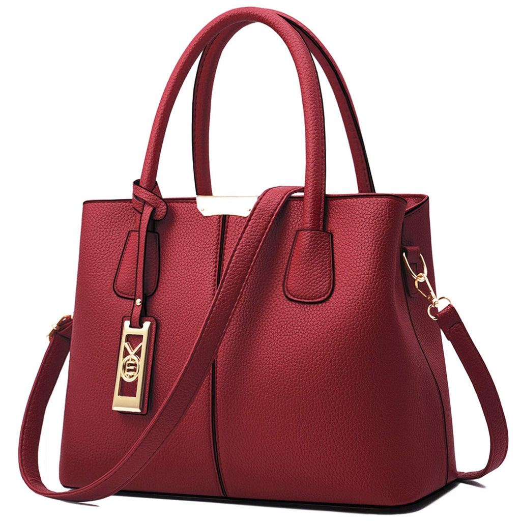 Red leather handbag with gold hardware, dual handles, and a detachable shoulder strap.