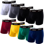 Assorted boxer briefs in gray, blue, black, red, yellow, green. Black waistband with white text.