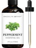 Brown bottle of peppermint essential oil with a black dropper, featuring mint leaves on the label.