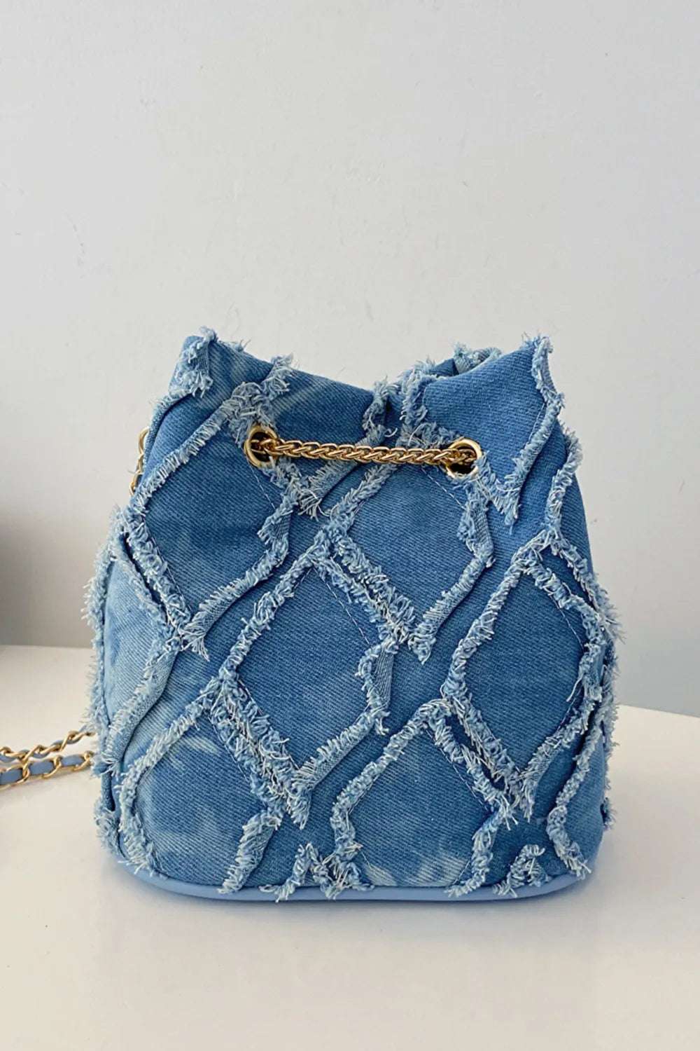 Chain Drawstring Raw Edge Denim Bucket Bag - Crossbody Bag by Trendsi | Available at Handbags Specialist Headquarter