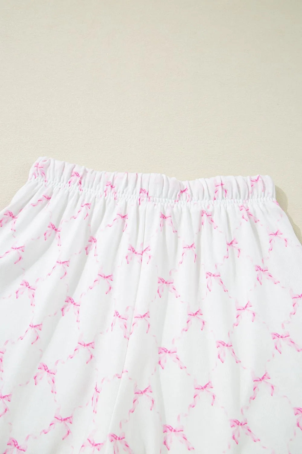 Bow Print Lettuce Trim Round Neck Top and Shorts Lounge Set - Sleepwear by Trendsi | Available at Handbags Specialist Headquarter