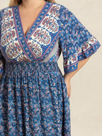 Plus Size Printed Surplice Half Sleeve Dress - Dresses by Trendsi | Available at Handbags Specialist Headquarter