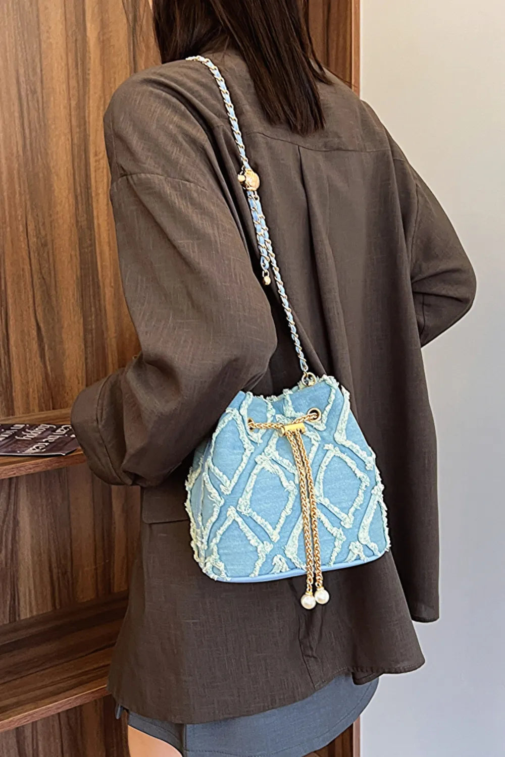 Chain Drawstring Raw Edge Denim Bucket Bag - Crossbody Bag by Trendsi | Available at Handbags Specialist Headquarter