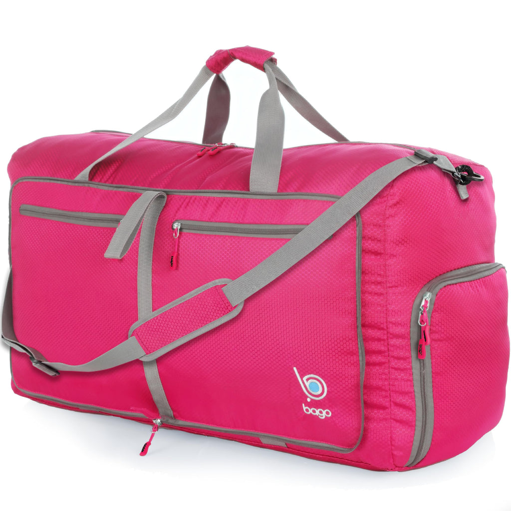 Pink duffel bag with gray straps and zippers, featuring a logo and multiple pockets.