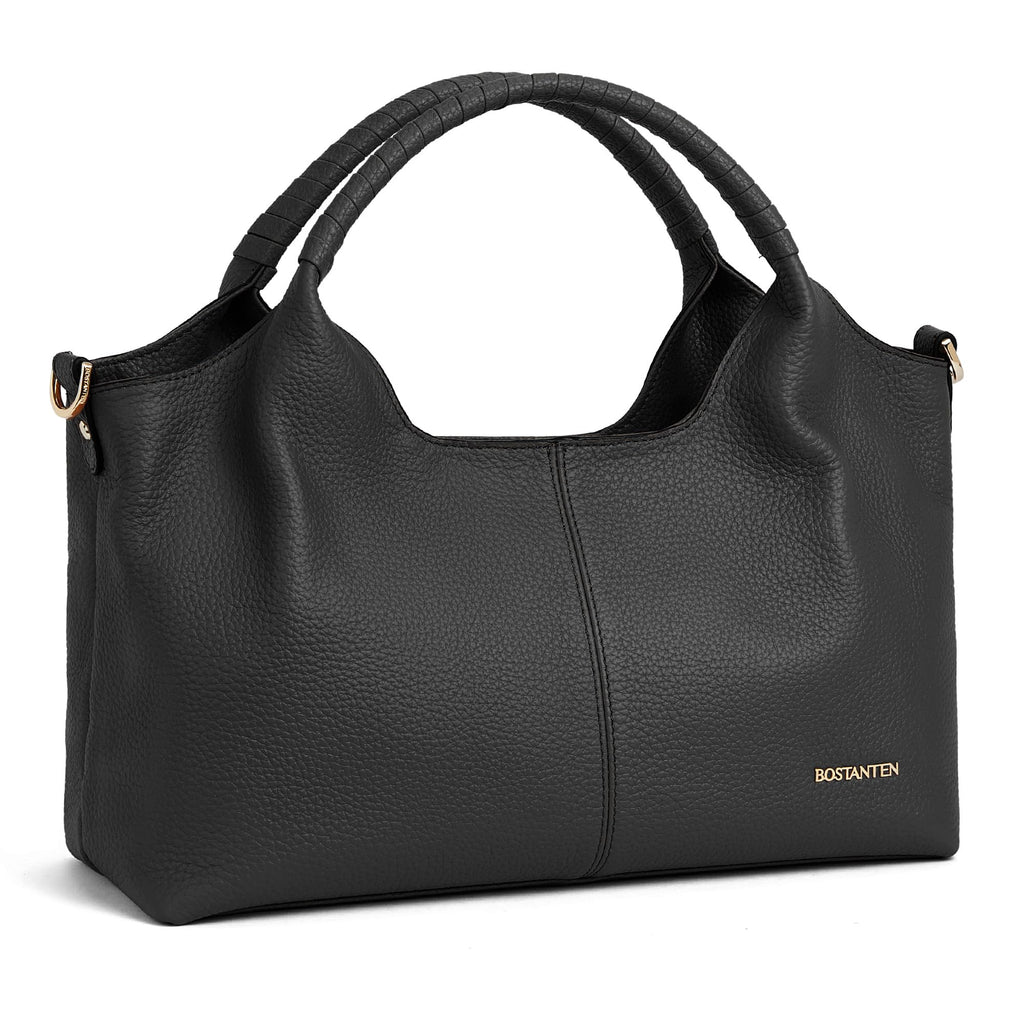 Black textured leather handbag with curved handles and gold accents.