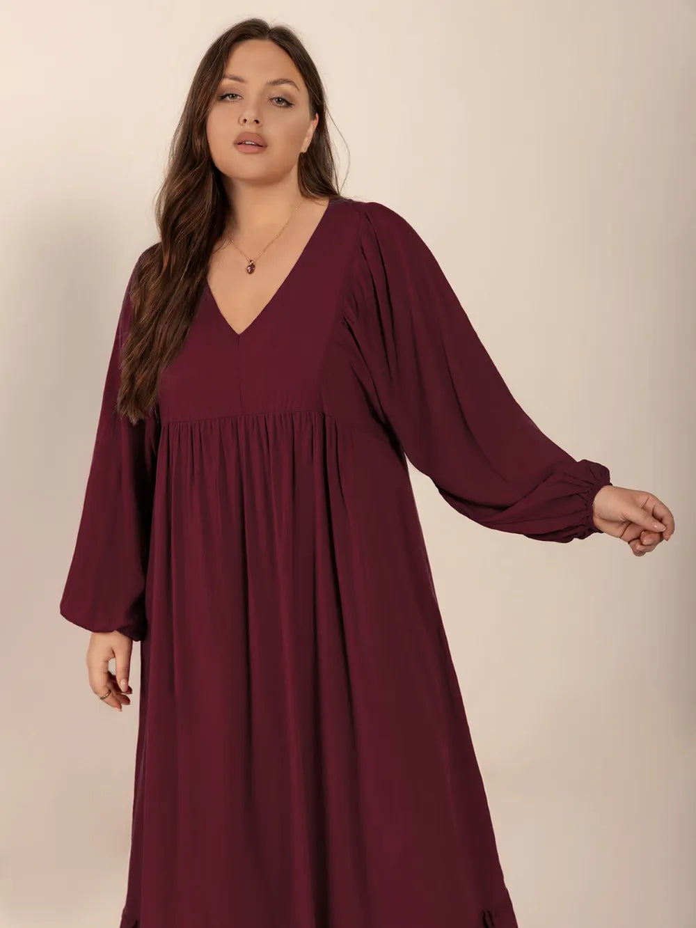Plus Size Ruffled Hem V-Neck Balloon Sleeve Dress - Dresses by Trendsi | Available at Handbags Specialist Headquarter