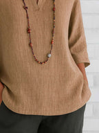 Full Size Notched Three-Quarter Sleeves Blouse Plus Size - Tops by Trendsi | Available at Handbags Specialist Headquarter