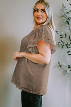 Plus Size Eyelet Round Neck Short Sleeve Blouse - Women Plus Size by Trendsi | Available at Handbags Specialist Headquarter