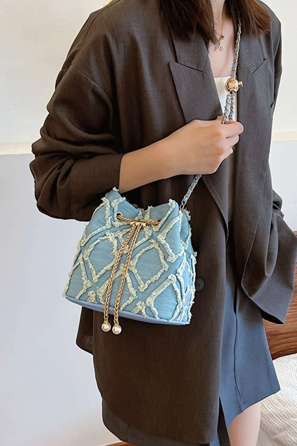 Chain Drawstring Raw Edge Denim Bucket Bag - Crossbody Bag by Trendsi | Available at Handbags Specialist Headquarter