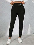 Full Size Letter Embroidered High Waist Leggings - Leggings by Trendsi | Available at Handbags Specialist Headquarter