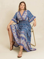 Plus Size Printed Surplice Half Sleeve Dress - Dresses by Trendsi | Available at Handbags Specialist Headquarter