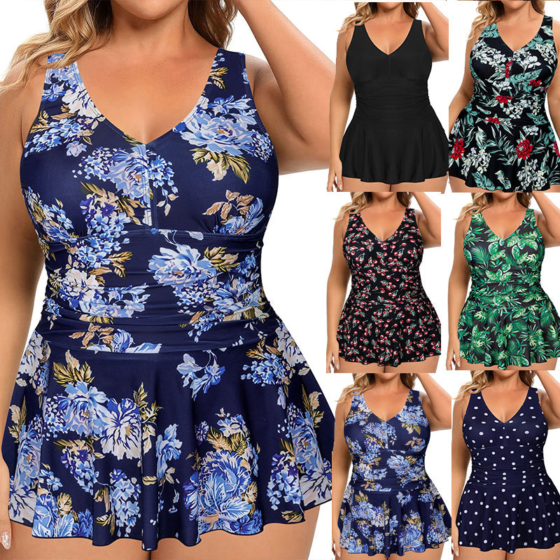 Variety of plus-size floral and patterned swimsuits in different colors, including blue, green, and black.