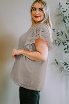 Plus Size Eyelet Round Neck Short Sleeve Blouse - Women Plus Size by Trendsi | Available at Handbags Specialist Headquarter
