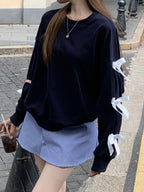 Bow-Detailed Sleeve Round Neck Sweatshirt - Tops by Trendsi | Available at Handbags Specialist Headquarter