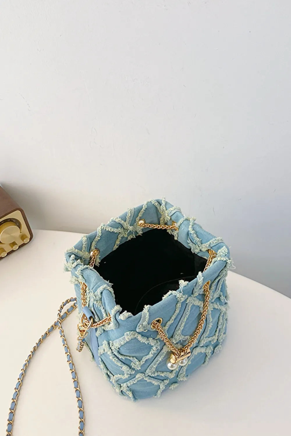 Chain Drawstring Raw Edge Denim Bucket Bag - Crossbody Bag by Trendsi | Available at Handbags Specialist Headquarter